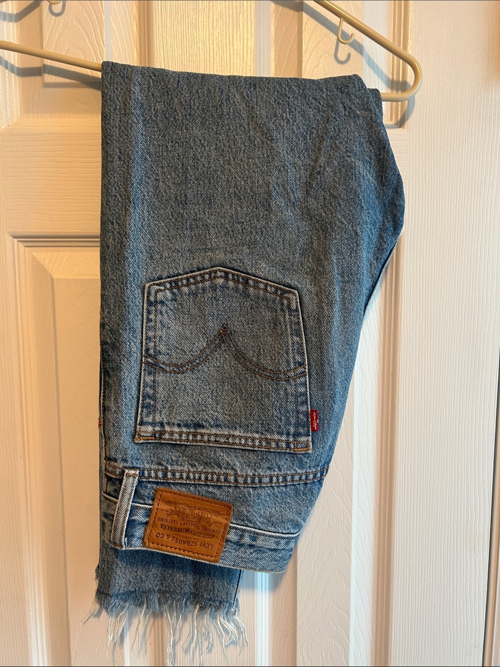 Levi's Medium Blue Denim Jeans with Frayed Hem